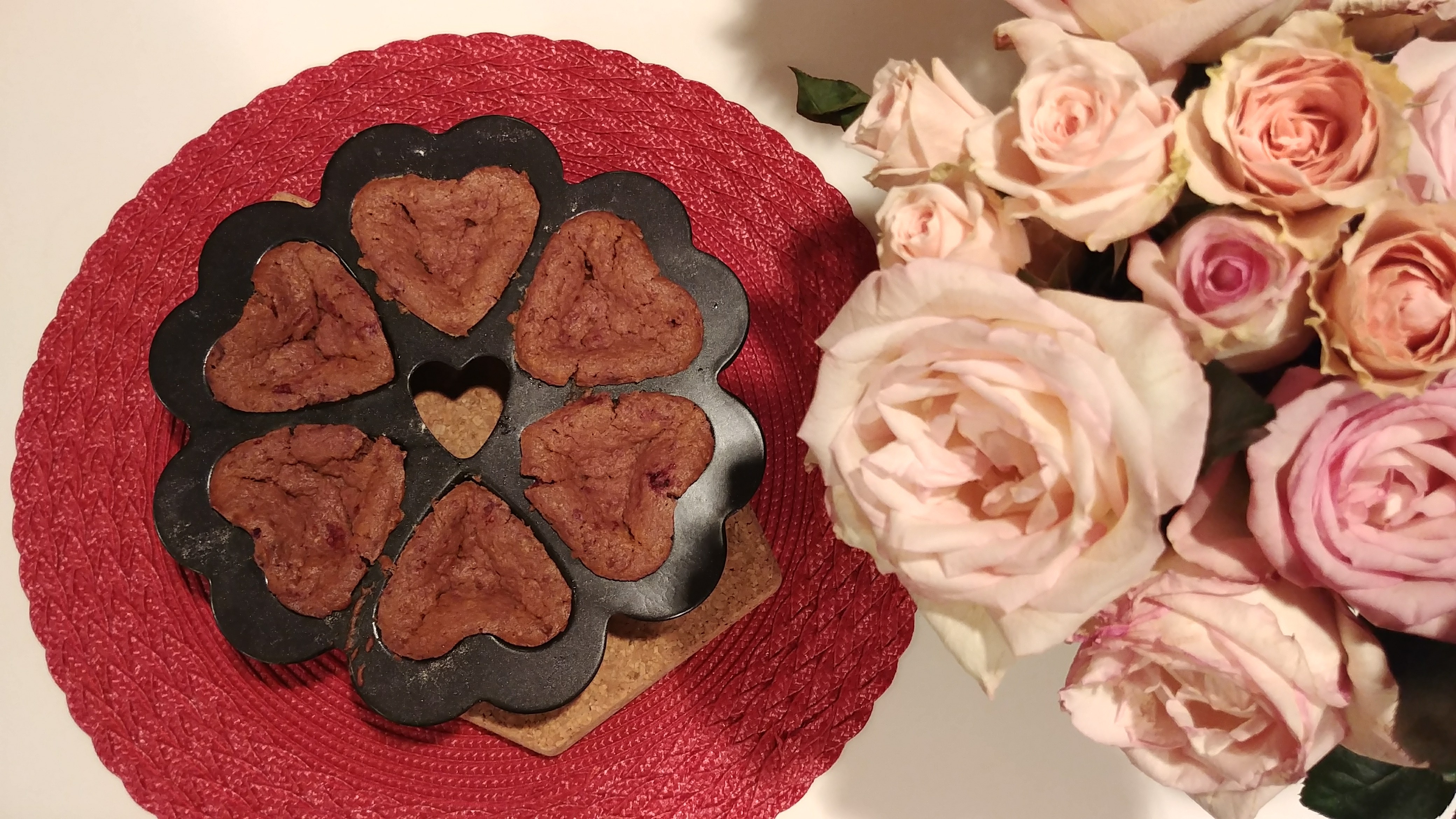 6 Cakelets in a Specialty Heart Pan with Roses on table