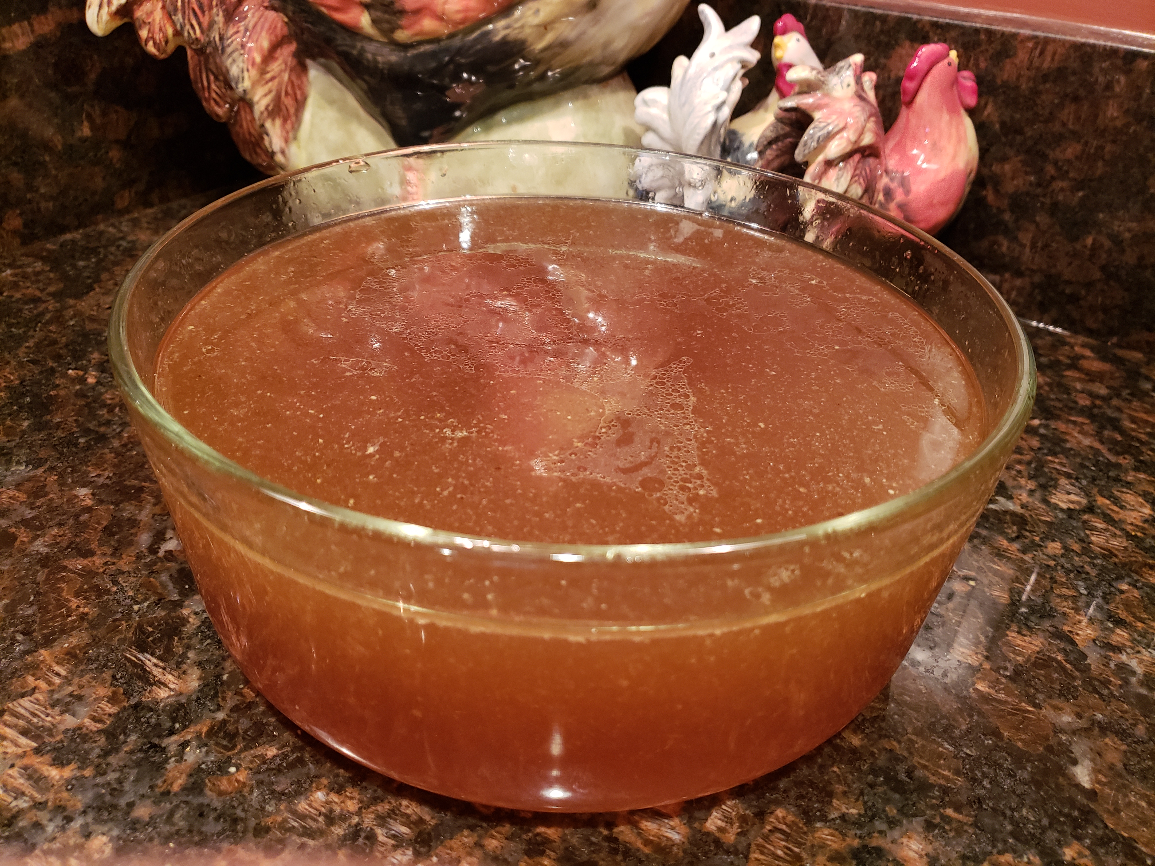 Strained Bone Broth in Glass Storage Container
