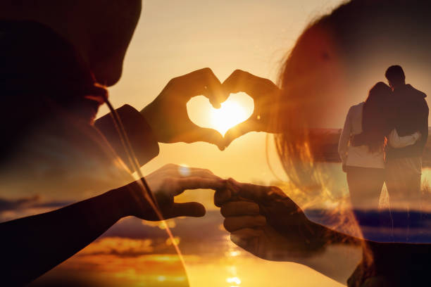 Double exposure of young couple of lovers against the background of a sunny sunset.